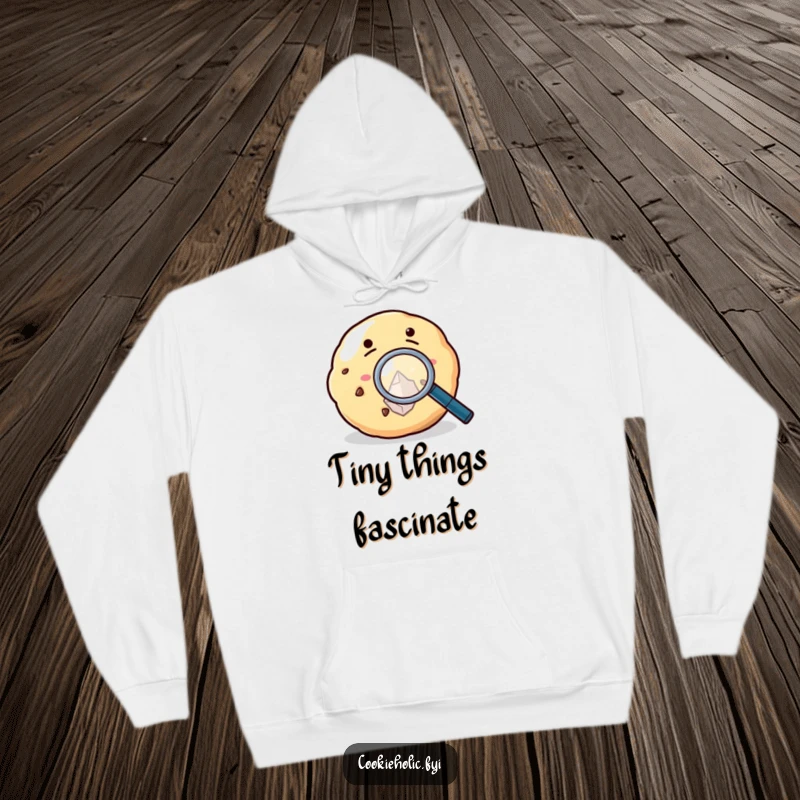 Funny Hoodie featuring a cookie peering through a magnifying glass at a sugar crystal, embodying sweet curiosity.